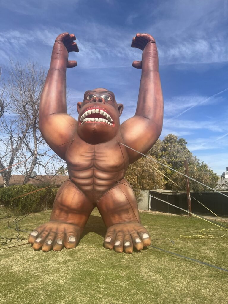 25 ft cold-air inflatable gorilla tethered on a lawn for a promotional event